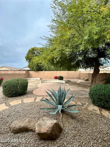 a view of a backyard of the house