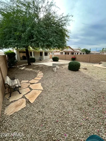 a view of a parking space with lots of trees
