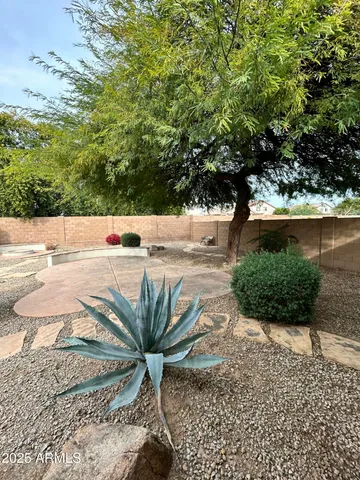 a view of a backyard of the house