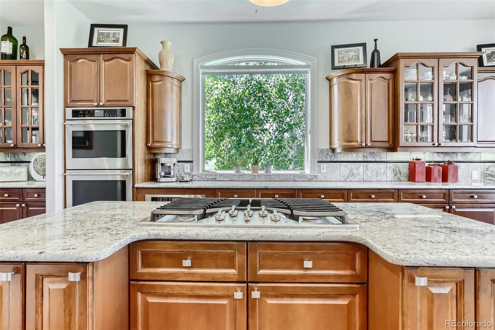 10189 Longview Drive Lone Tree, CO 80124 - Photo 13 of 40 a kitchen with granite countertop a sink and a granite counter tops