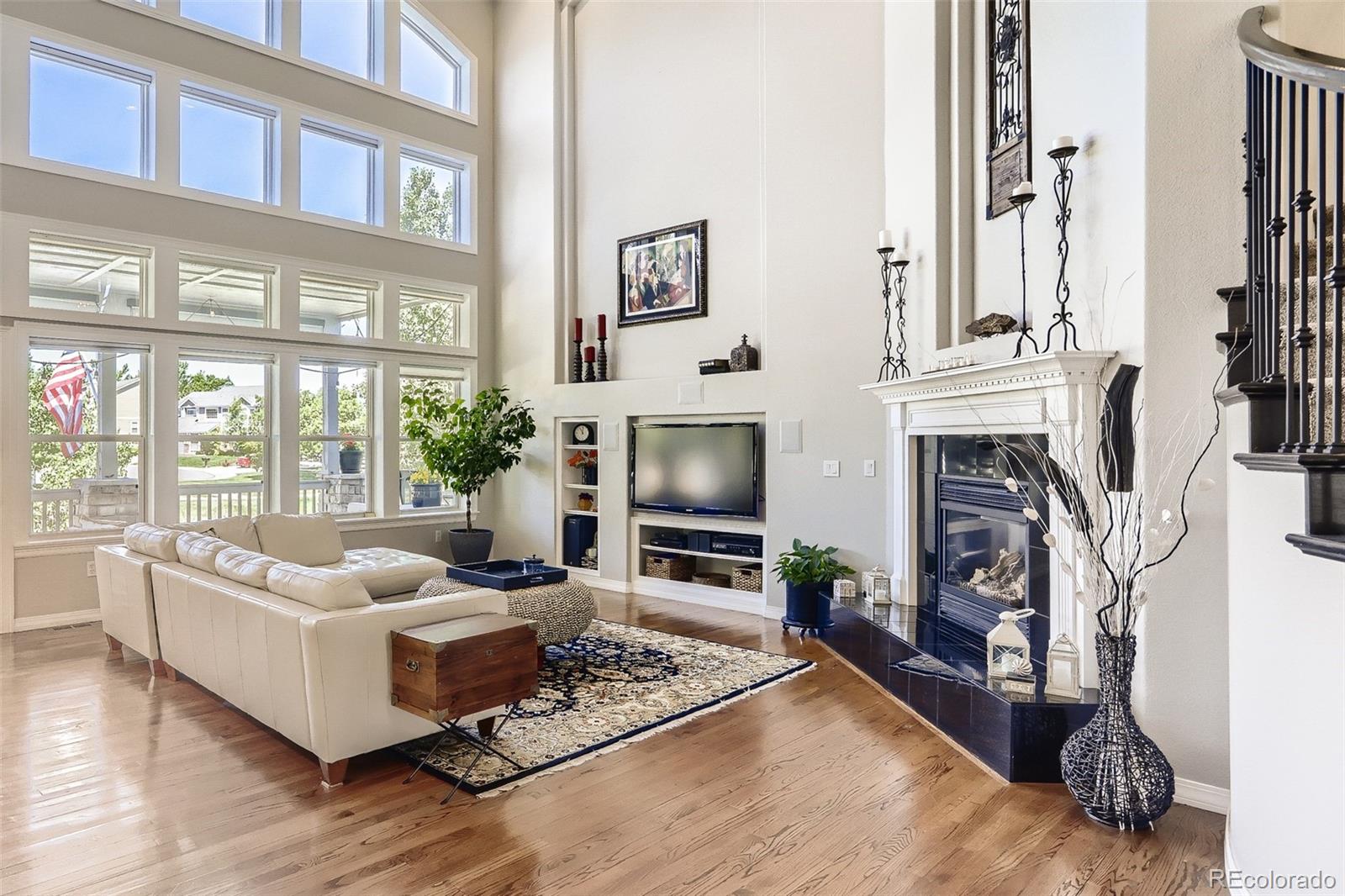 10189 Longview Drive Lone Tree, CO 80124 - Photo 15 of 40 a living room with furniture fireplace and flat screen tv