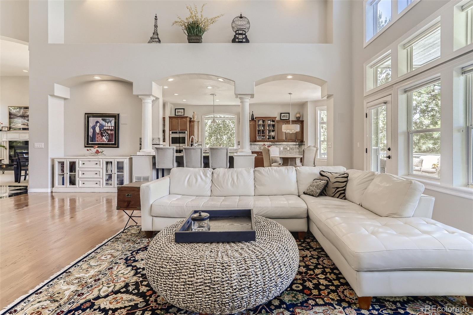 10189 Longview Drive Lone Tree, CO 80124 - Photo 16 of 40 a living room with furniture a large window and a table
