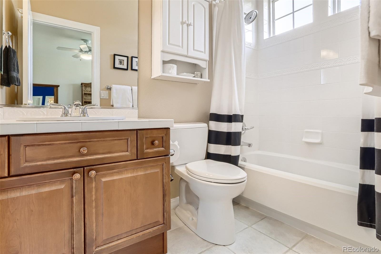 10189 Longview Drive Lone Tree, CO 80124 - Photo 27 of 40 a bathroom with a sink a toilet and bathtub