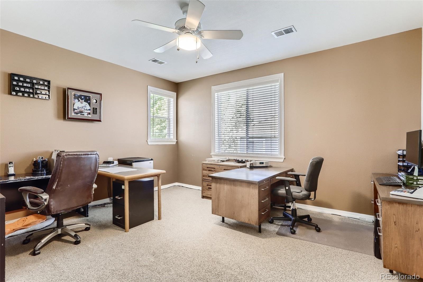 10189 Longview Drive Lone Tree, CO 80124 - Photo 29 of 40 a view of a workspace with furniture and a window