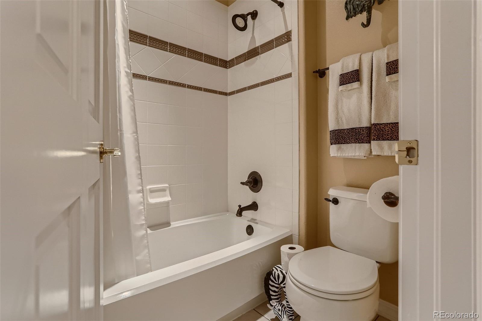 10189 Longview Drive Lone Tree, CO 80124 - Photo 31 of 40 a bathroom with a toilet and a shower