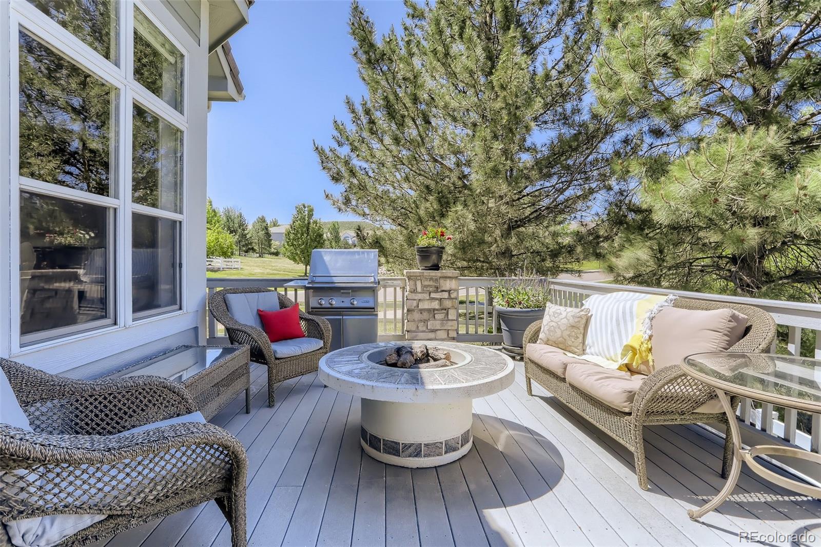 10189 Longview Drive Lone Tree, CO 80124 - Photo 35 of 40 a view of a patio with couches chairs and a potted plant