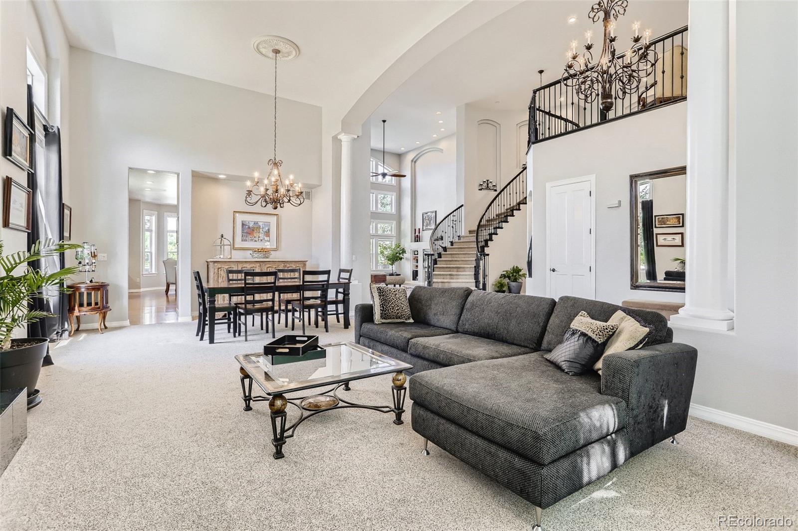 10189 Longview Drive Lone Tree, CO 80124 - Photo 7 of 40 a living room with furniture and wooden floor