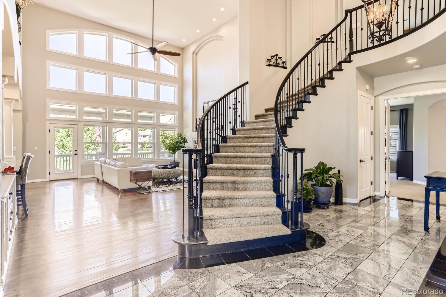 10189 Longview Drive Lone Tree, CO 80124 - Photo 9 of 40 a view of entryway and hall with wooden floor
