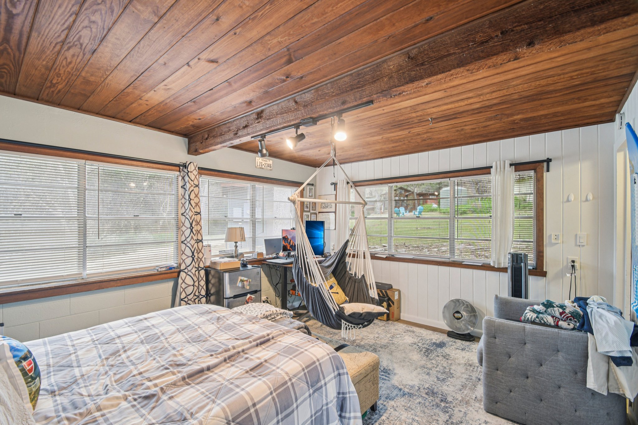 2108 River Hills Road Austin, TX 78733 - Photo 14 of 35 a bed room with a bed and a large window