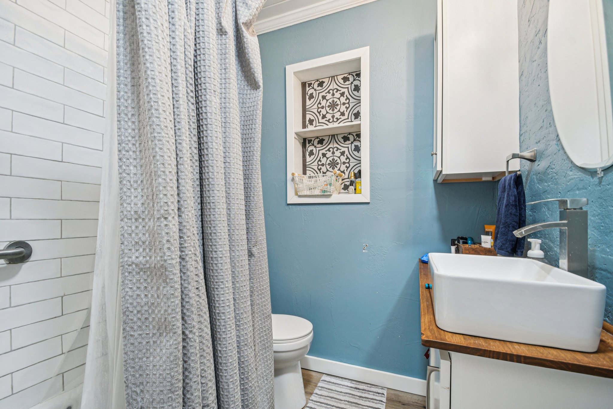 2108 River Hills Road Austin, TX 78733 - Photo 15 of 35 a bathroom with a sink toilet and shower