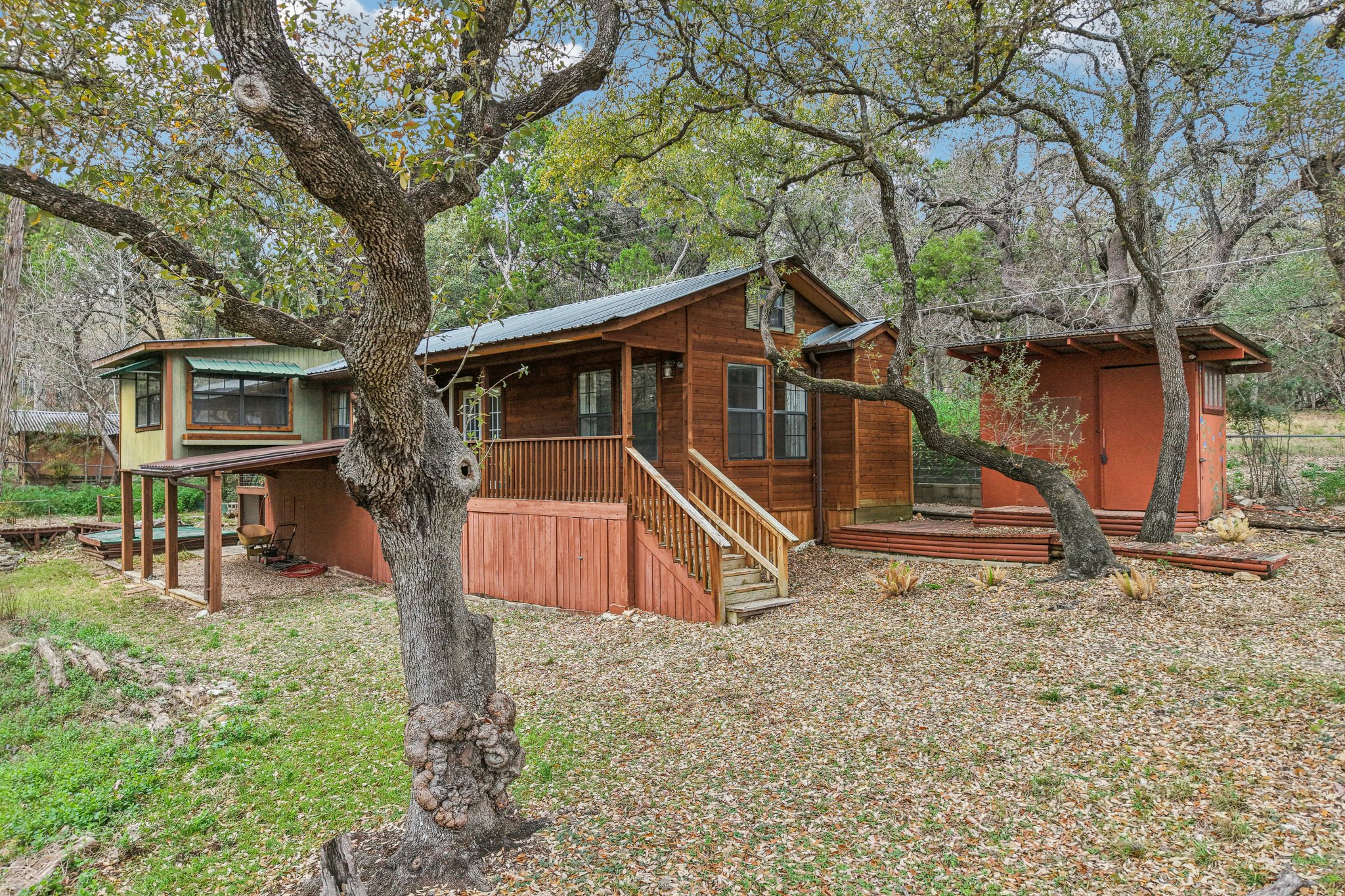 2108 River Hills Road Austin, TX 78733 - Photo 17 of 35 a view of a house with a yard and large trees