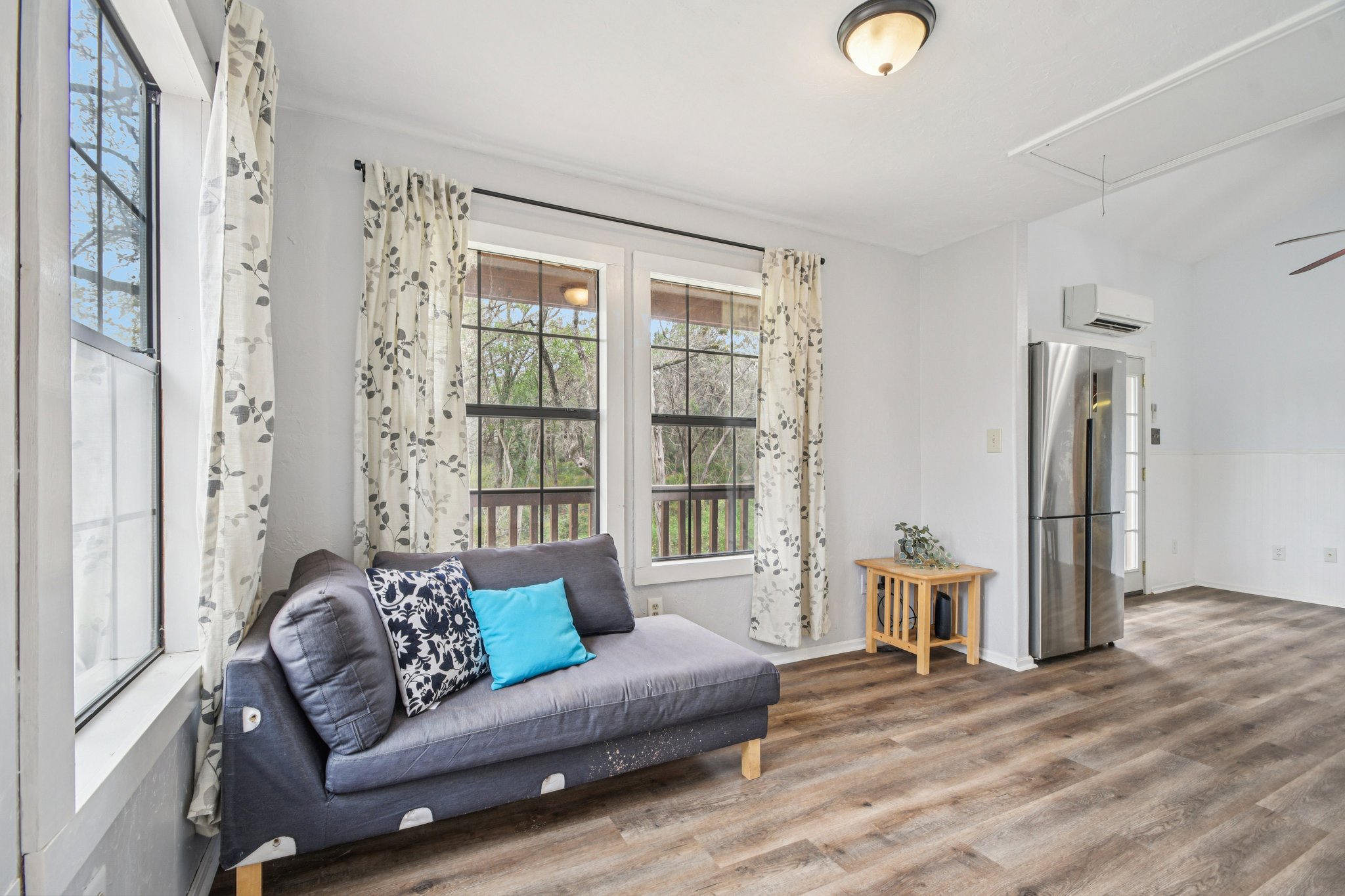 2108 River Hills Road Austin, TX 78733 - Photo 22 of 35 a living room with furniture and a window