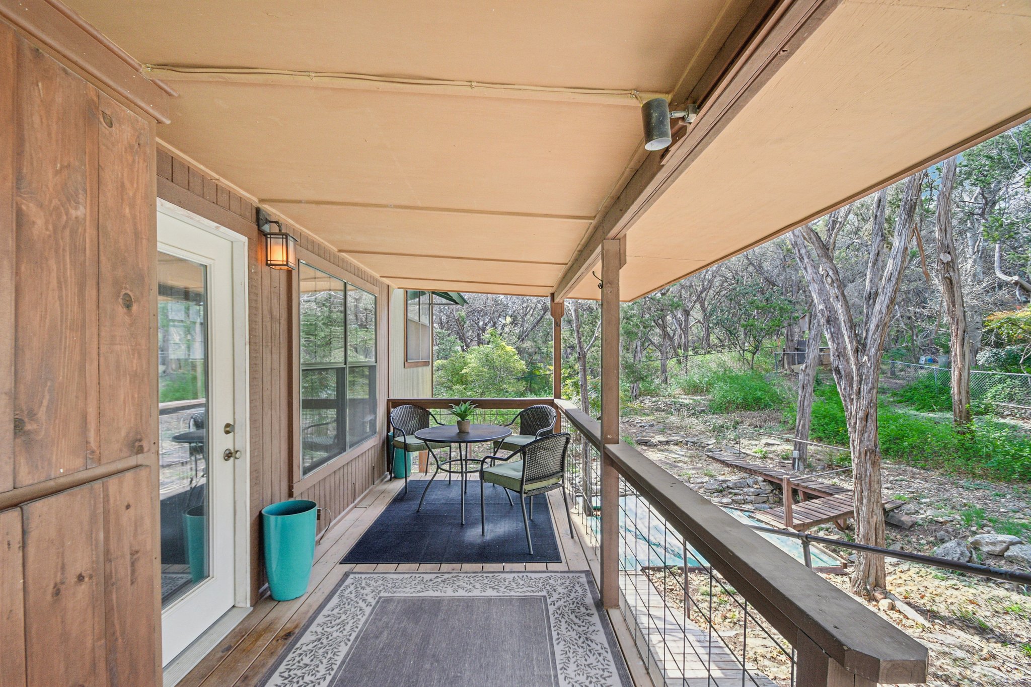 2108 River Hills Road Austin, TX 78733 - Photo 27 of 35 a porch with wooden floor outdoor seating and yard