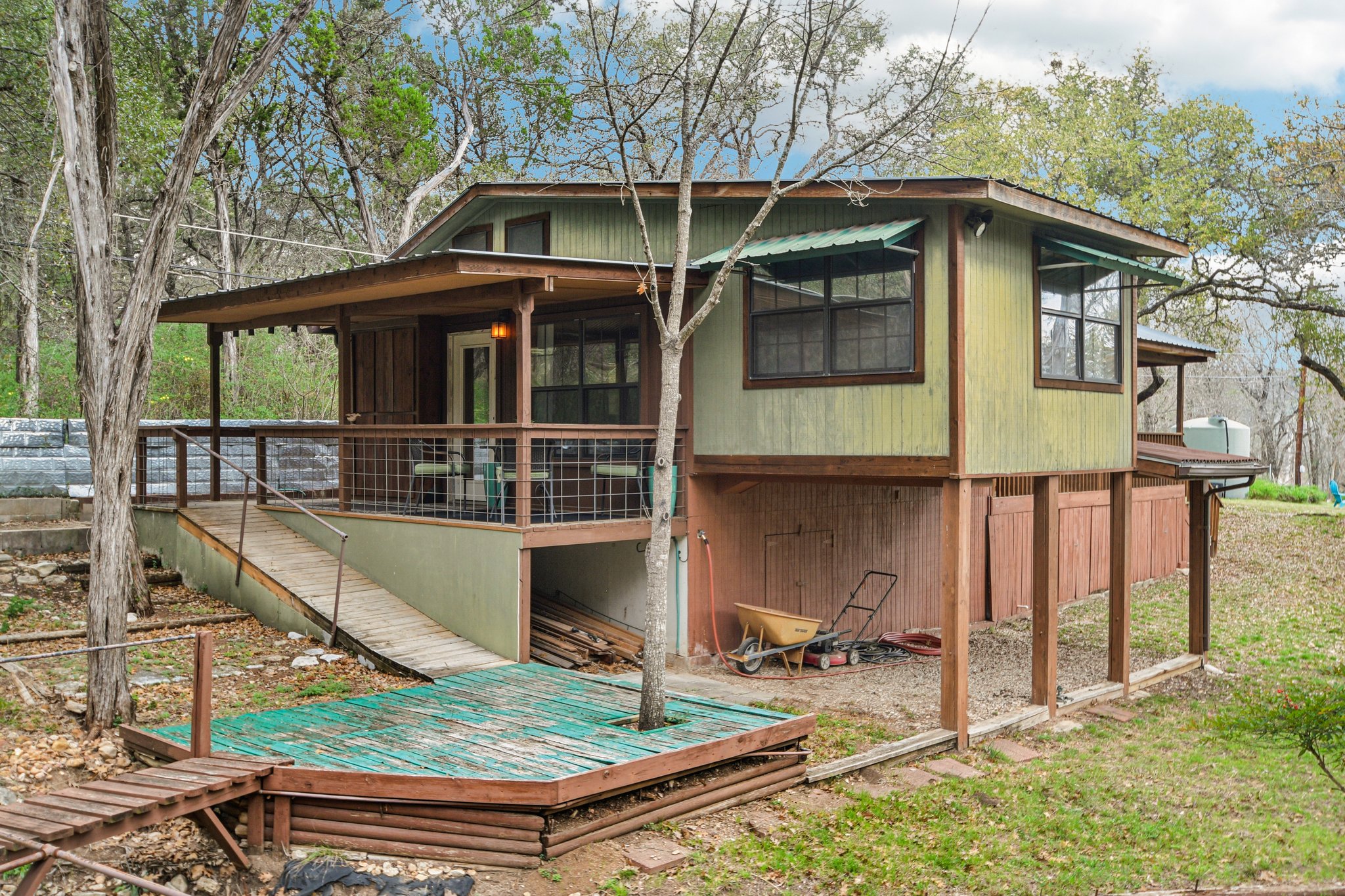 2108 River Hills Road Austin, TX 78733 - Photo 28 of 35 a front view of a house with garden