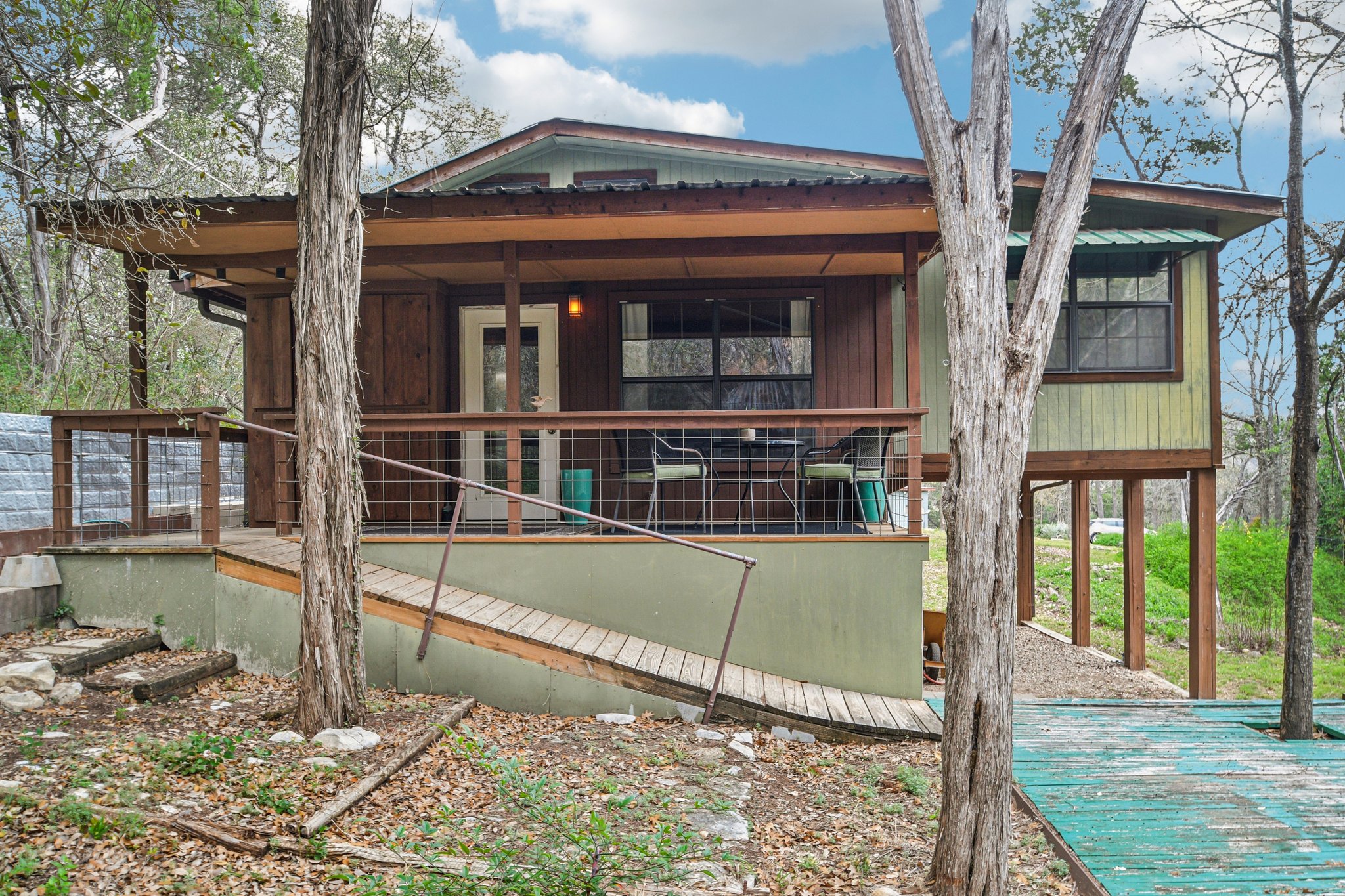2108 River Hills Road Austin, TX 78733 - Photo 29 of 35 a view of a house with backyard and sitting area