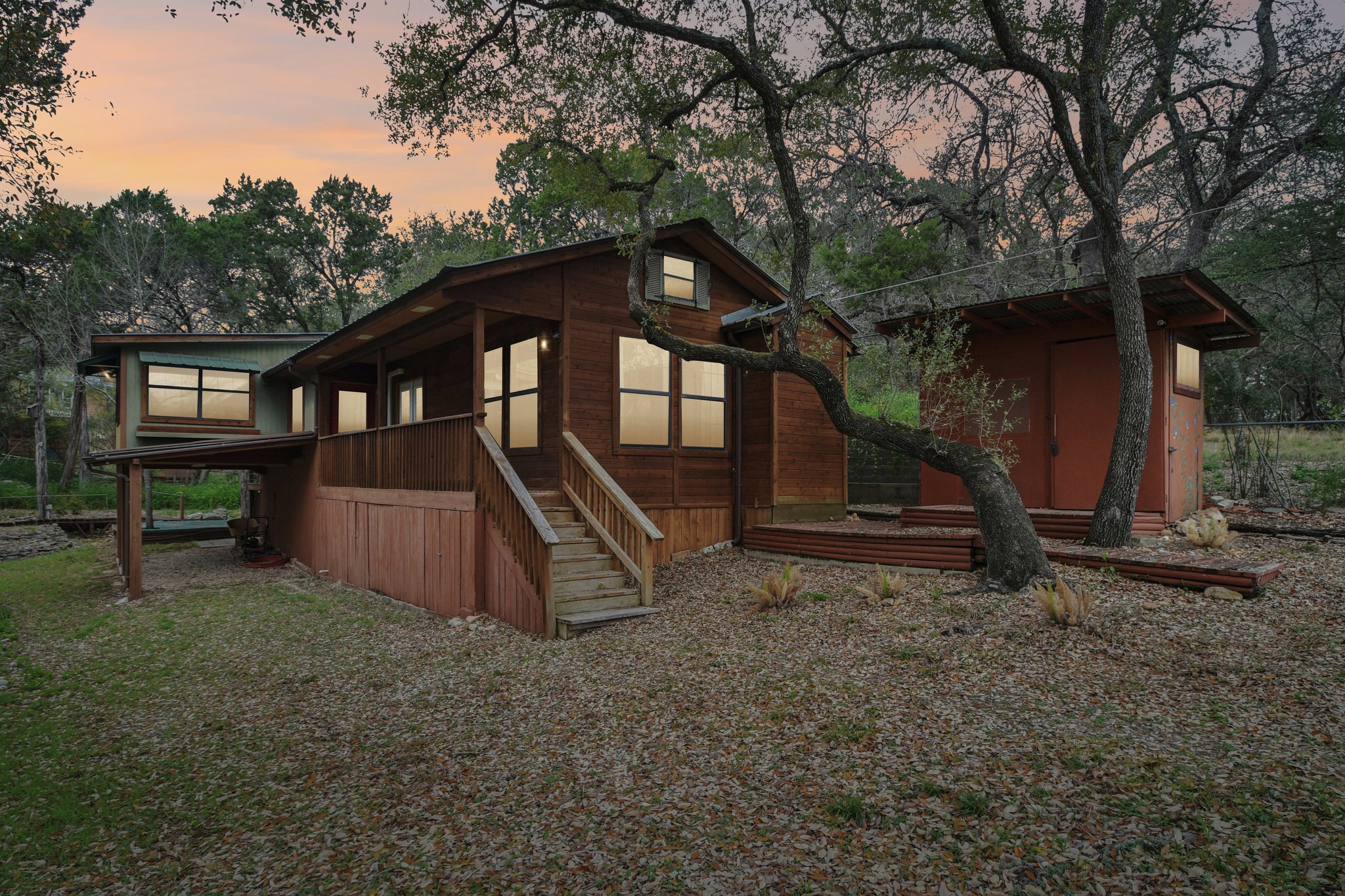 2108 River Hills Road Austin, TX 78733 - Photo 31 of 35 a view of a house with backyard and trees