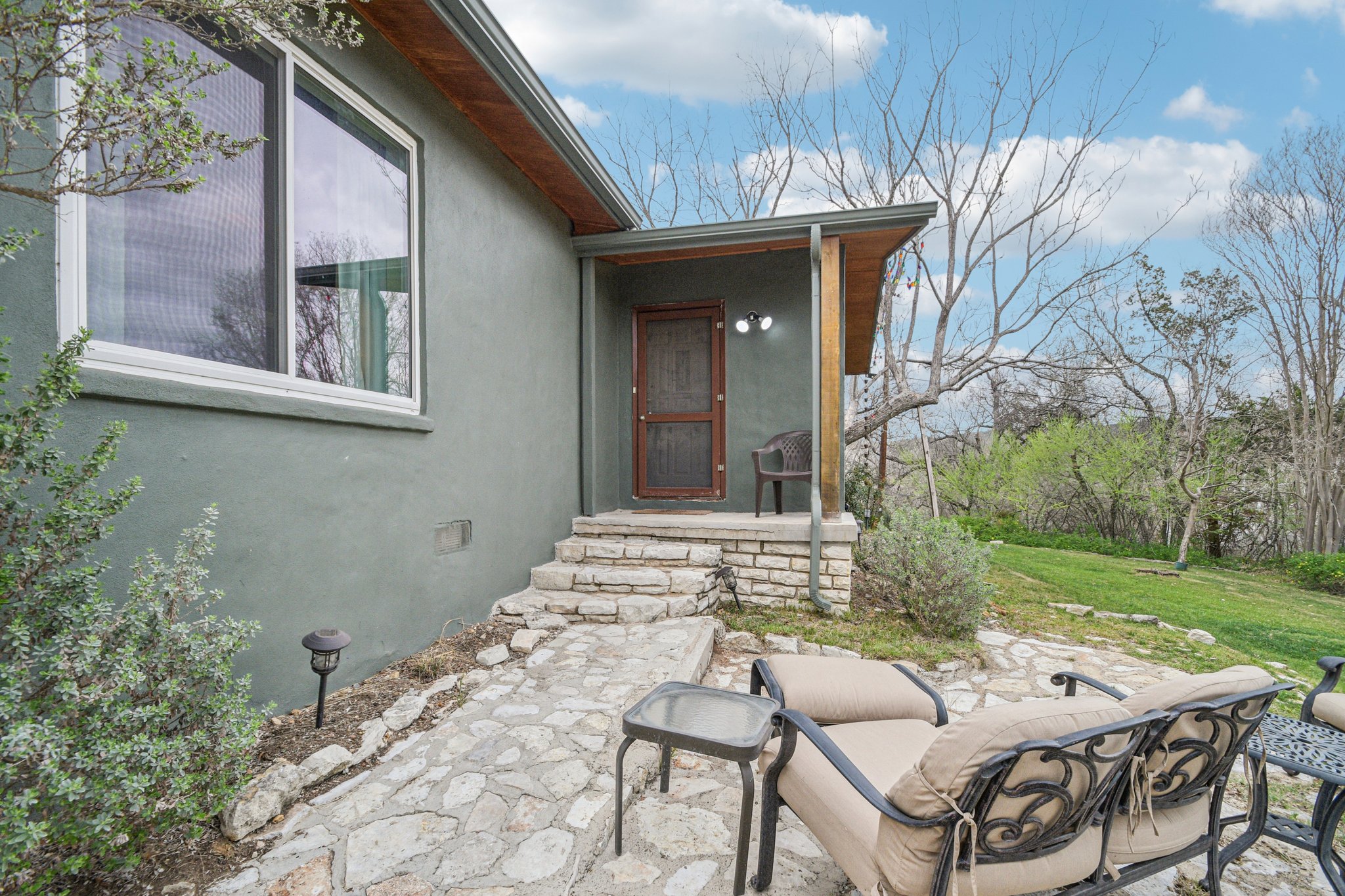 2108 River Hills Road Austin, TX 78733 - Photo 6 of 35 a view of a patio with table and chairs and potted plants
