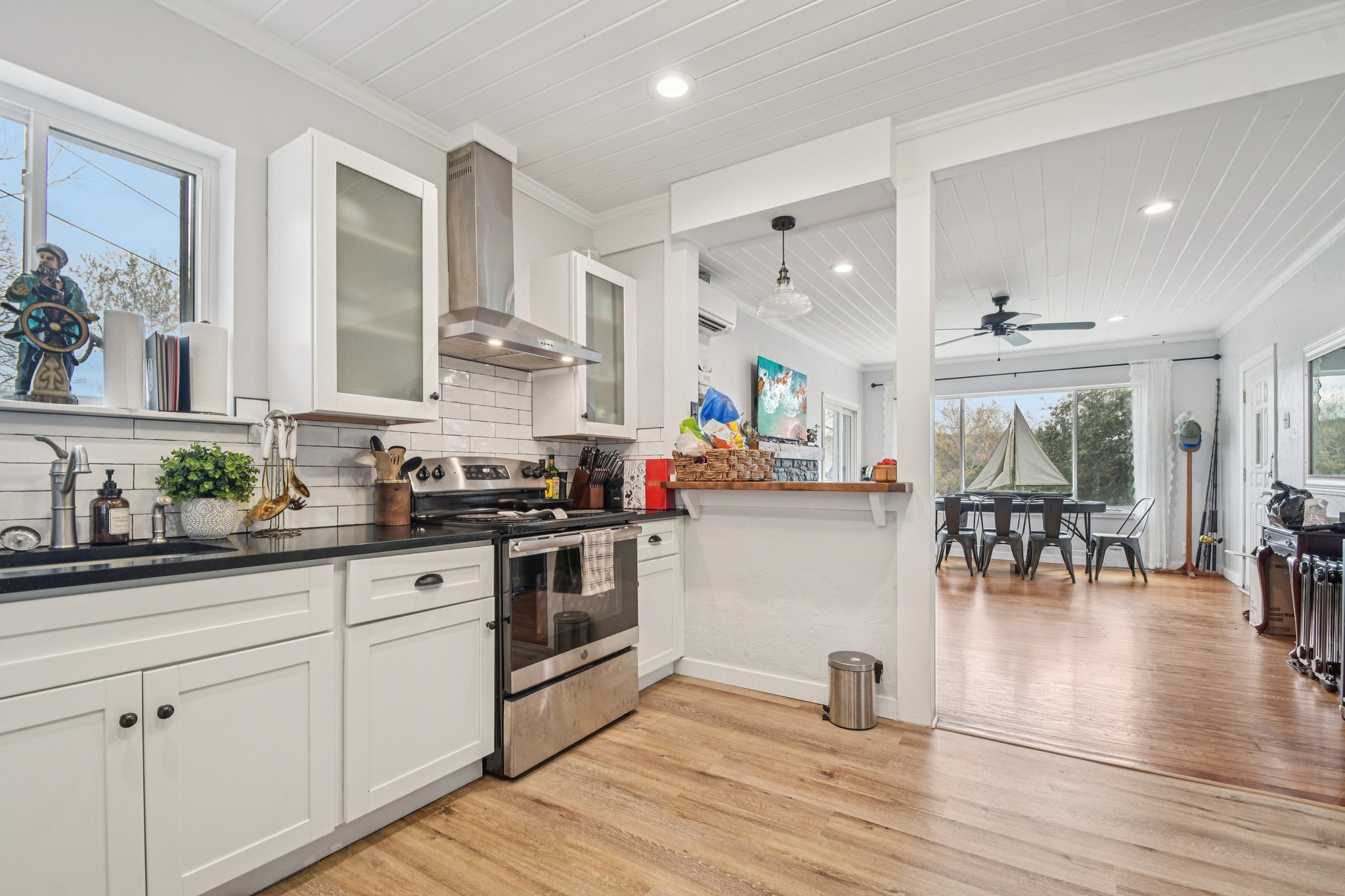 2108 River Hills Road Austin, TX 78733 - Photo 9 of 35 a kitchen with stainless steel appliances granite countertop a stove and cabinets
