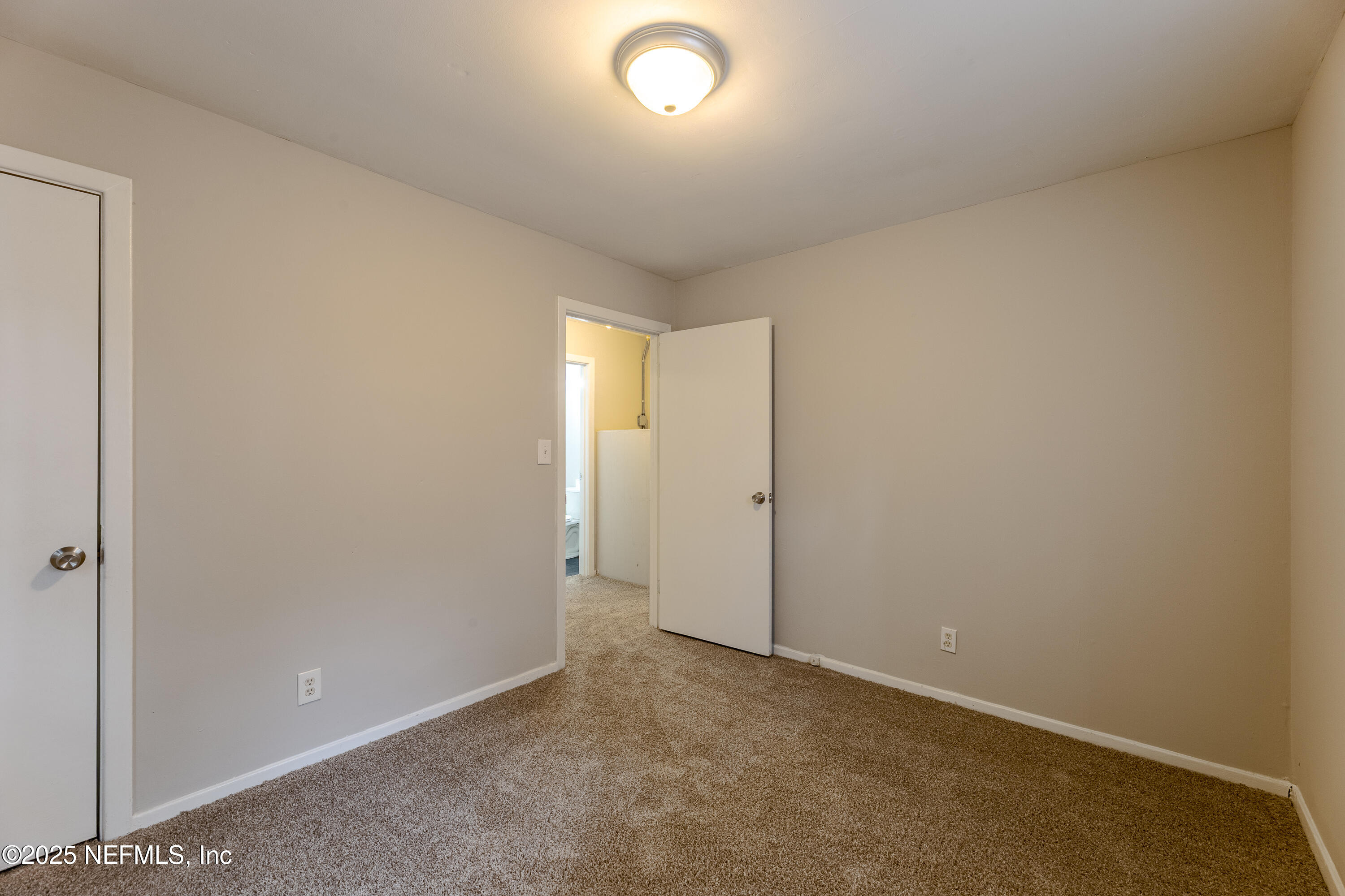 2387 2nd Avenue Jacksonville, FL 32208 - Photo 16 of 20 an empty room with closet and windows