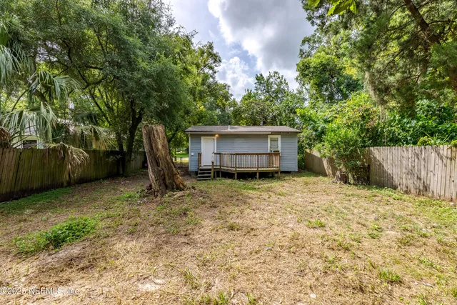a house with trees in the background