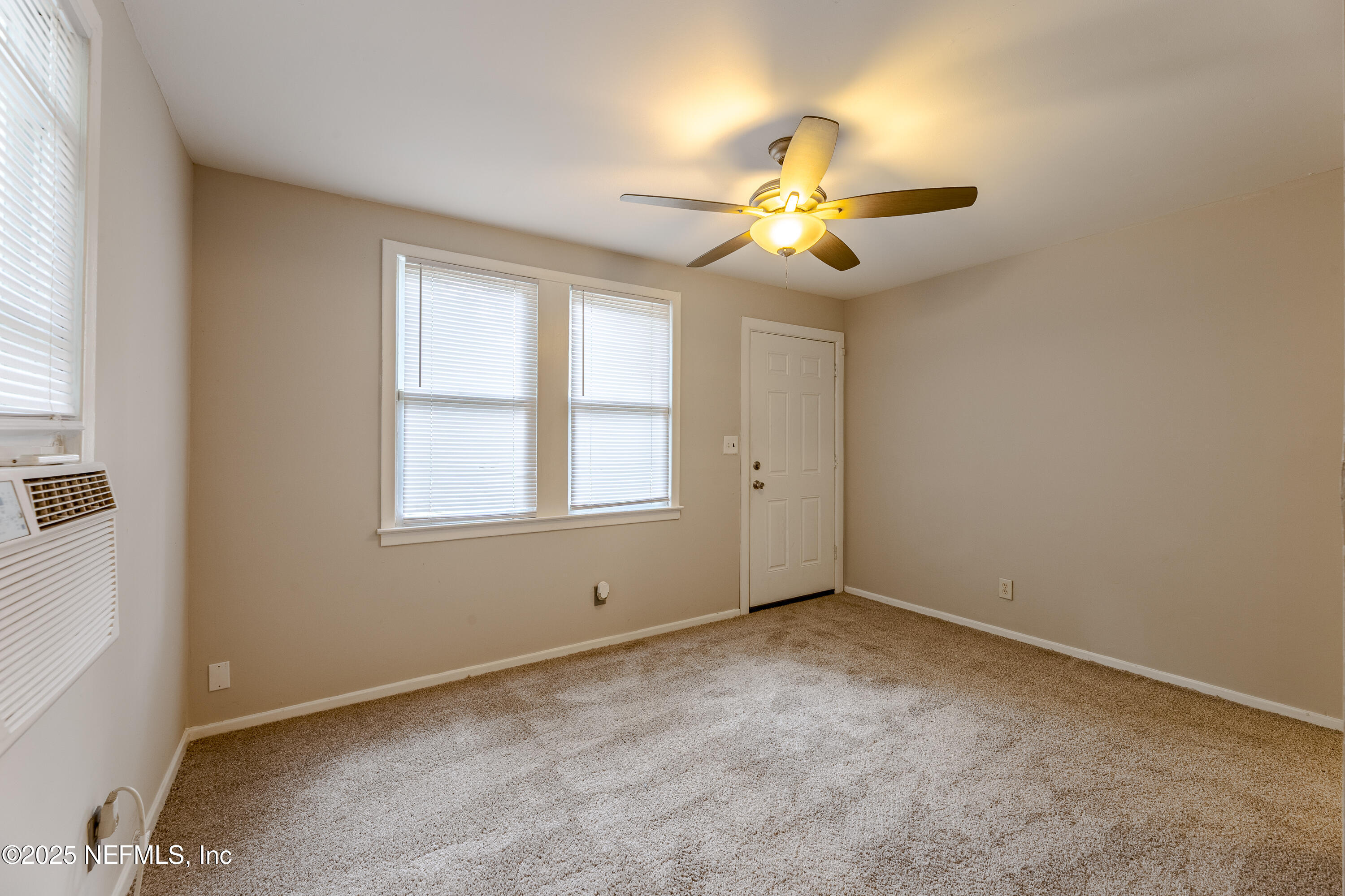 2387 2nd Avenue Jacksonville, FL 32208 - Photo 7 of 20 an empty room with windows and fan