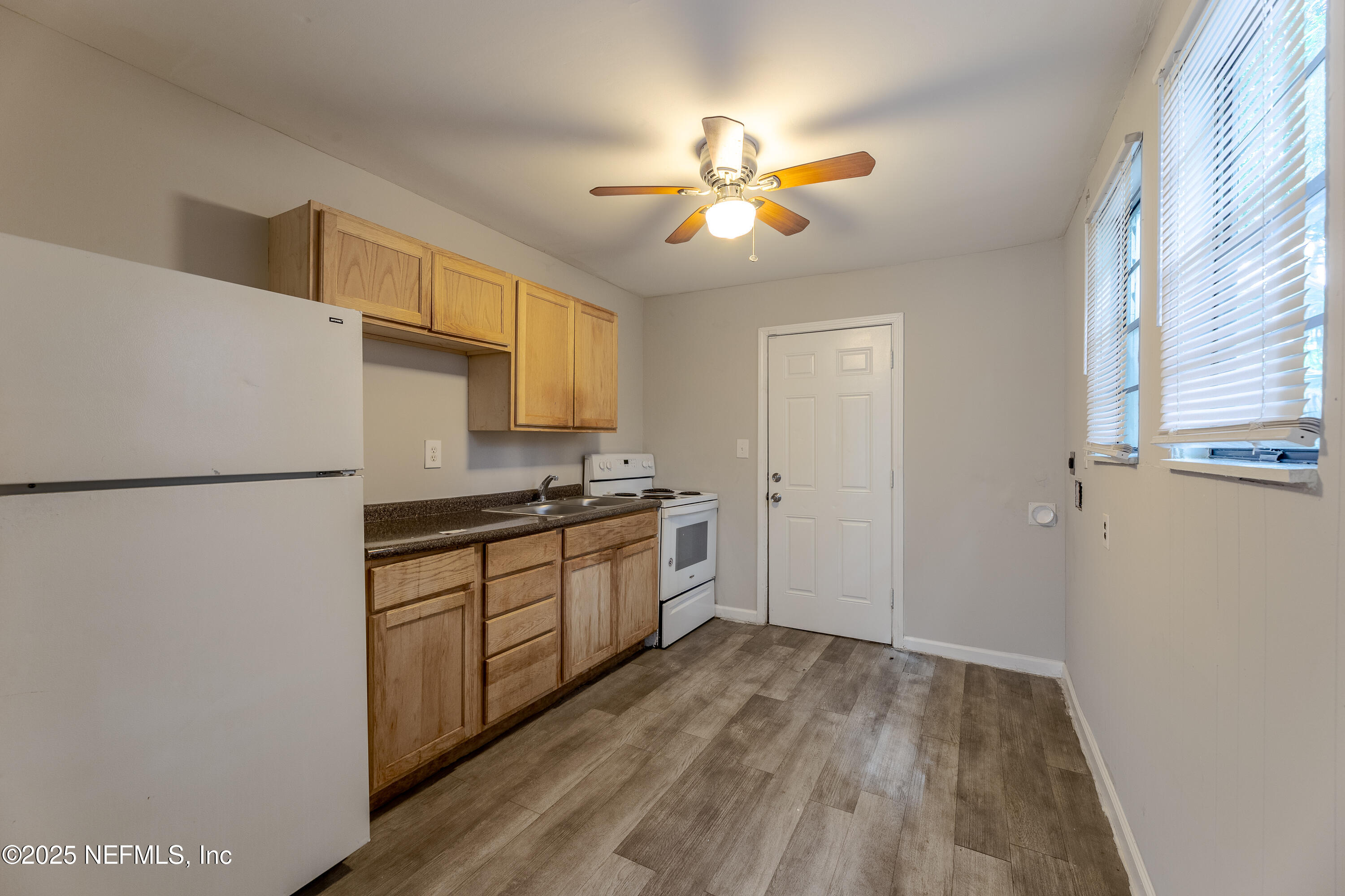 2387 2nd Avenue Jacksonville, FL 32208 - Photo 10 of 20 a kitchen with a refrigerator and a sink