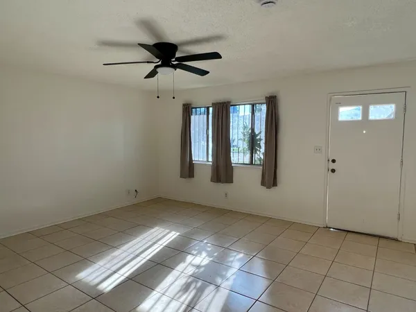 a view of an empty room and window