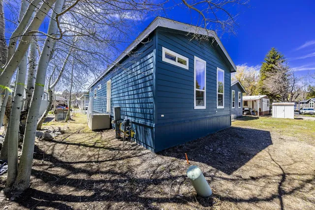 a view of a couches with wooden fence