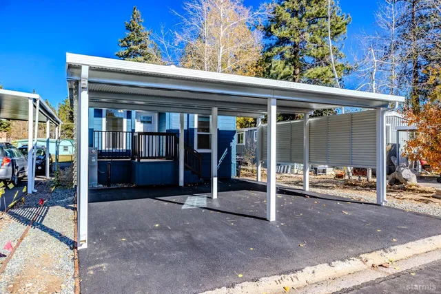 a view of a patio with table and chairs and potted plants