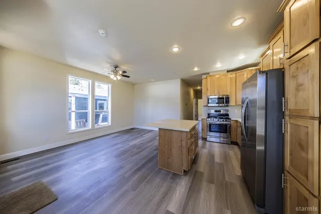 a view of kitchen with furniture and wooden floor