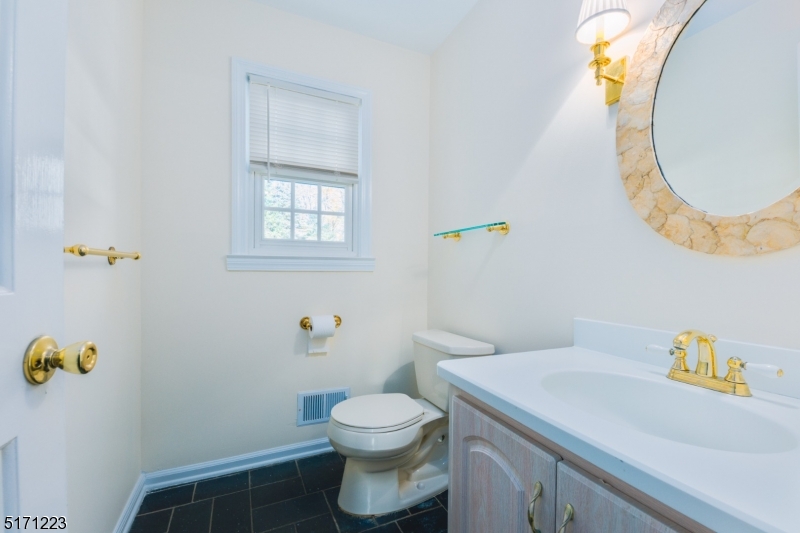 64 Old Coach Road Bernards, NJ 07920 - Photo 15 of 32 a bathroom with a sink and a toilet