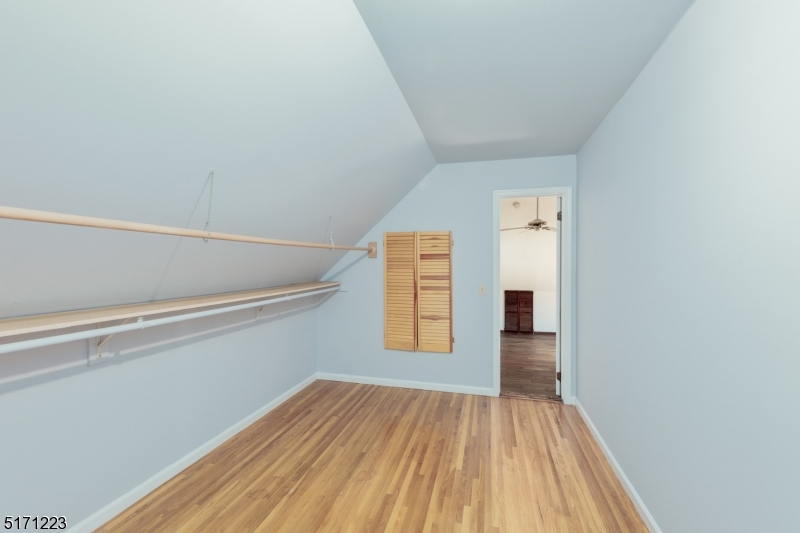 64 Old Coach Road Bernards, NJ 07920 - Photo 23 of 32 a view of an empty room with window and wooden floor