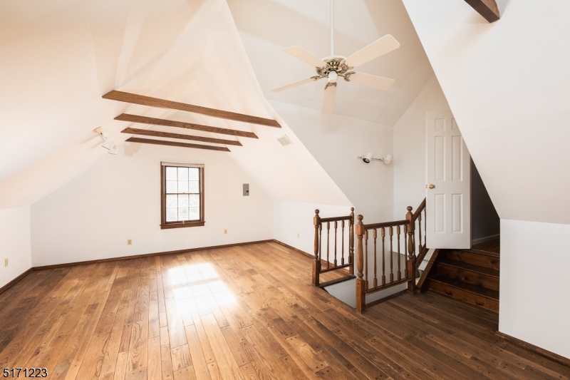 64 Old Coach Road Bernards, NJ 07920 - Photo 24 of 32 wooden floor with staircase and windows