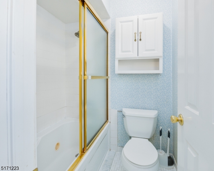 64 Old Coach Road Bernards, NJ 07920 - Photo 26 of 32 a white toilet sitting next to a bathroom sink