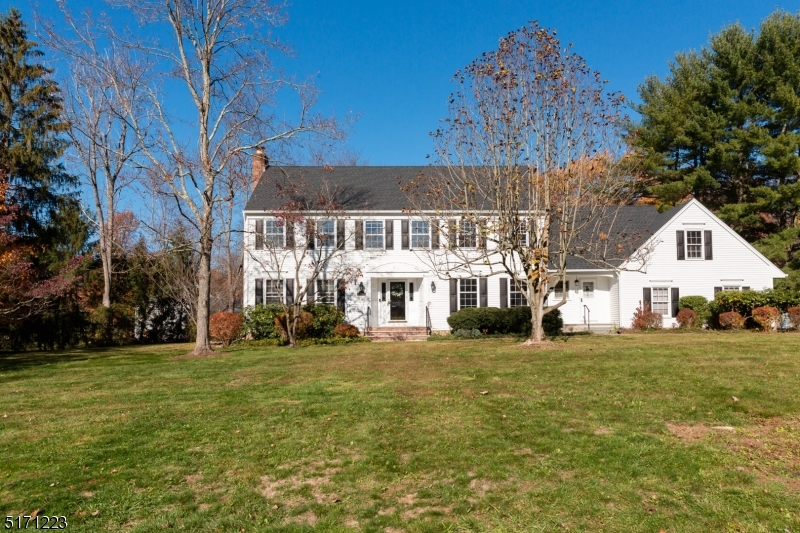 64 Old Coach Road Bernards, NJ 07920 - Photo 4 of 32 a front view of a house with a garden