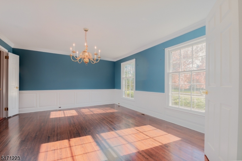 64 Old Coach Road Bernards, NJ 07920 - Photo 8 of 32 wooden floor in an empty room with a window
