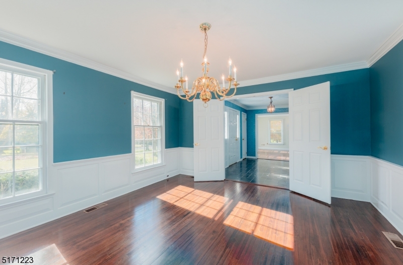 64 Old Coach Road Bernards, NJ 07920 - Photo 9 of 32 wooden floor in an empty room with a window