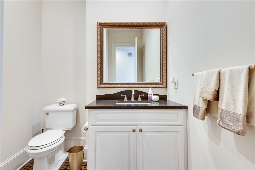 187 Fontaine Road Southwest Mableton, GA 30126 - Photo 37 of 84 a bathroom with a granite countertop sink and a mirror