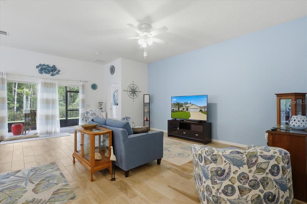 35 Birdie Way Bunnell, FL 32110 - Photo 10 of 57 a living room with furniture and a flat screen tv