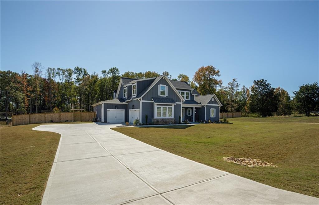 255 Old Town Road Dacula, GA 30019 - Photo 8 of 38 a front view of a house with a yard