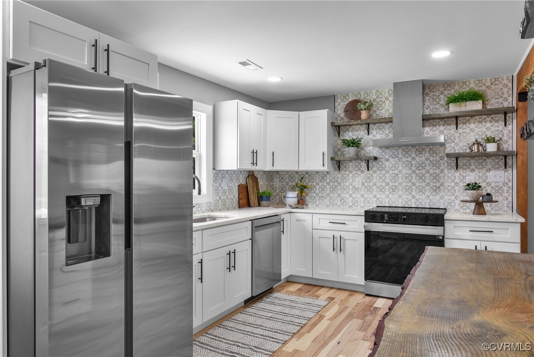 8501 Barnetts Road Charles City, VA 23030 - Photo 12 of 33 Kitchen with white cabinets, stainless steel appli
