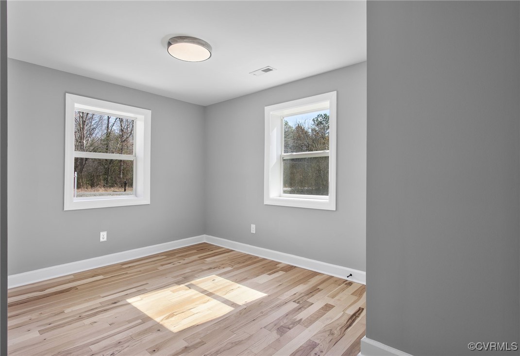 8501 Barnetts Road Charles City, VA 23030 - Photo 20 of 33 Empty room featuring baseboards, visible vents, an