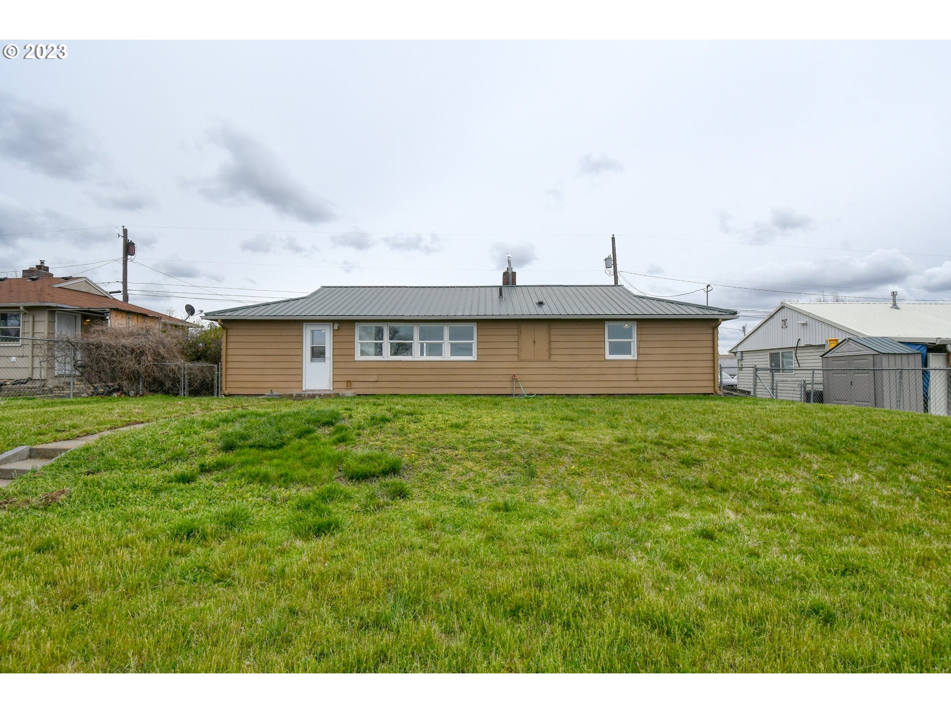 1617 Southwest Hailey Avenue Pendleton, OR 97801 - Photo 22 of 24 a view of a house with a backyard