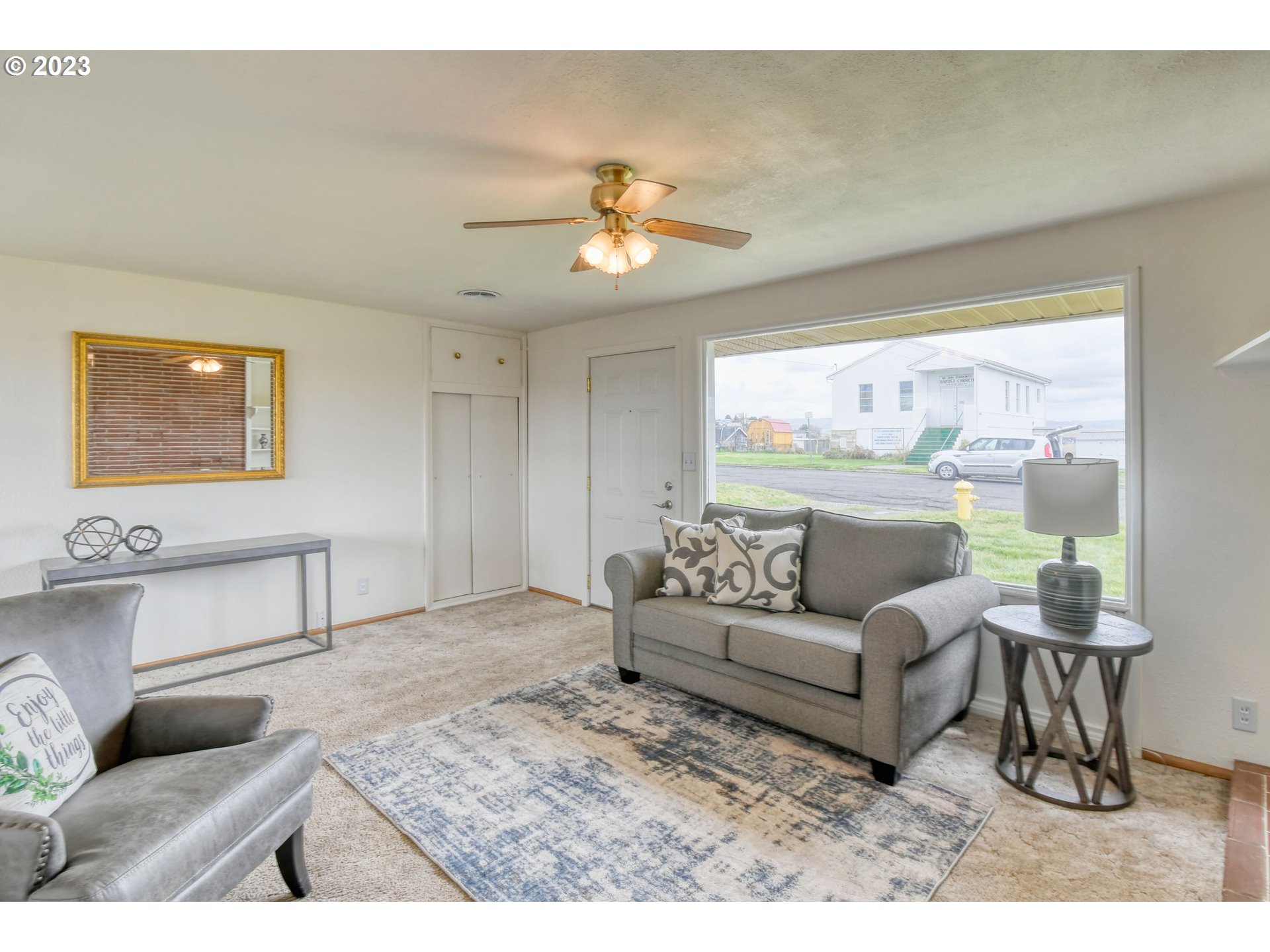 1617 Southwest Hailey Avenue Pendleton, OR 97801 - Photo 3 of 24 a living room with furniture and a large window