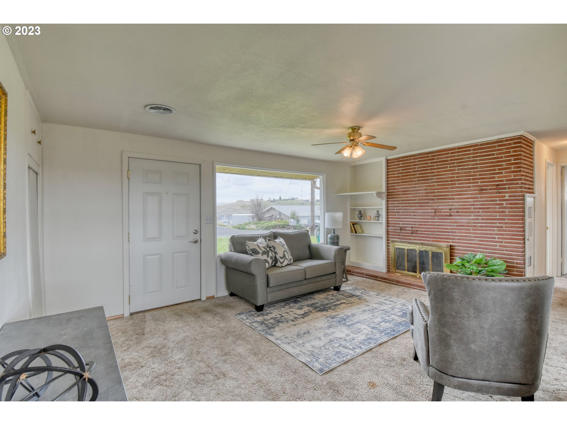 1617 Southwest Hailey Avenue Pendleton, OR 97801 - Photo 4 of 24 a living room with furniture and a fireplace