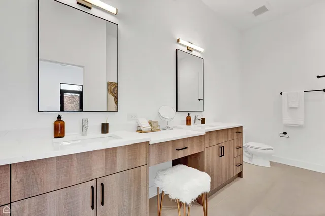 a bathroom with a sink double vanity and a mirror