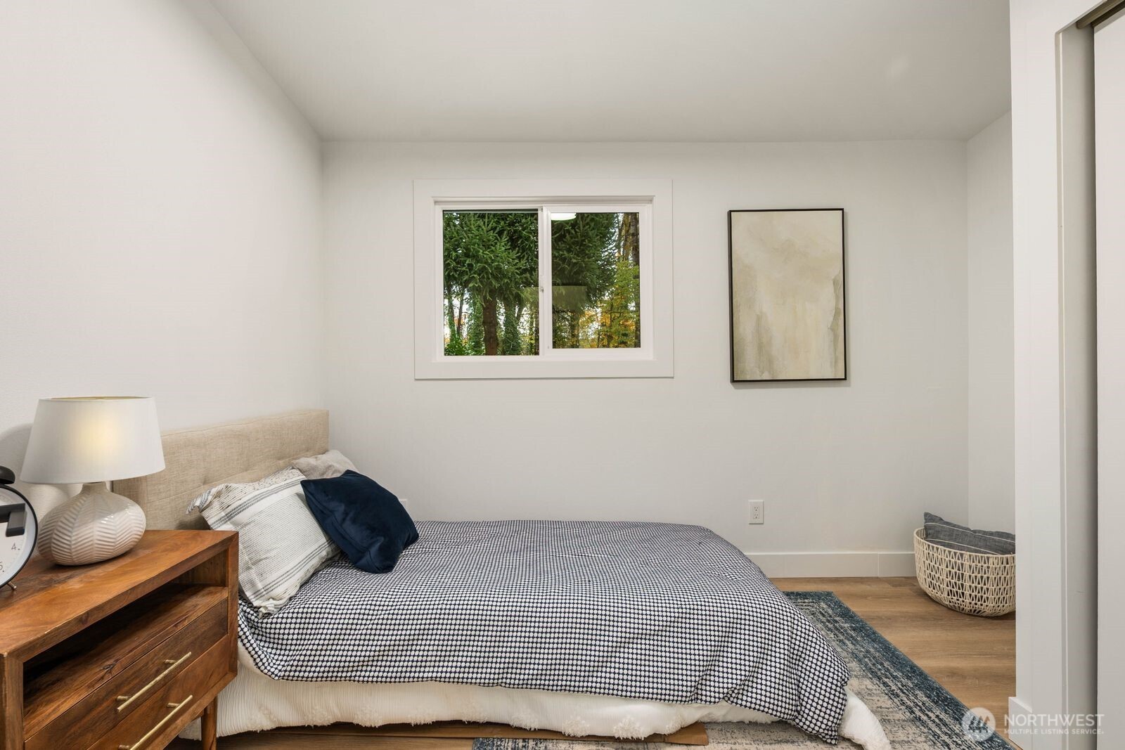 14866 154th Place Southeast Renton, WA 98058 - Photo 17 of 36 a bedroom with a bed and wooden floor