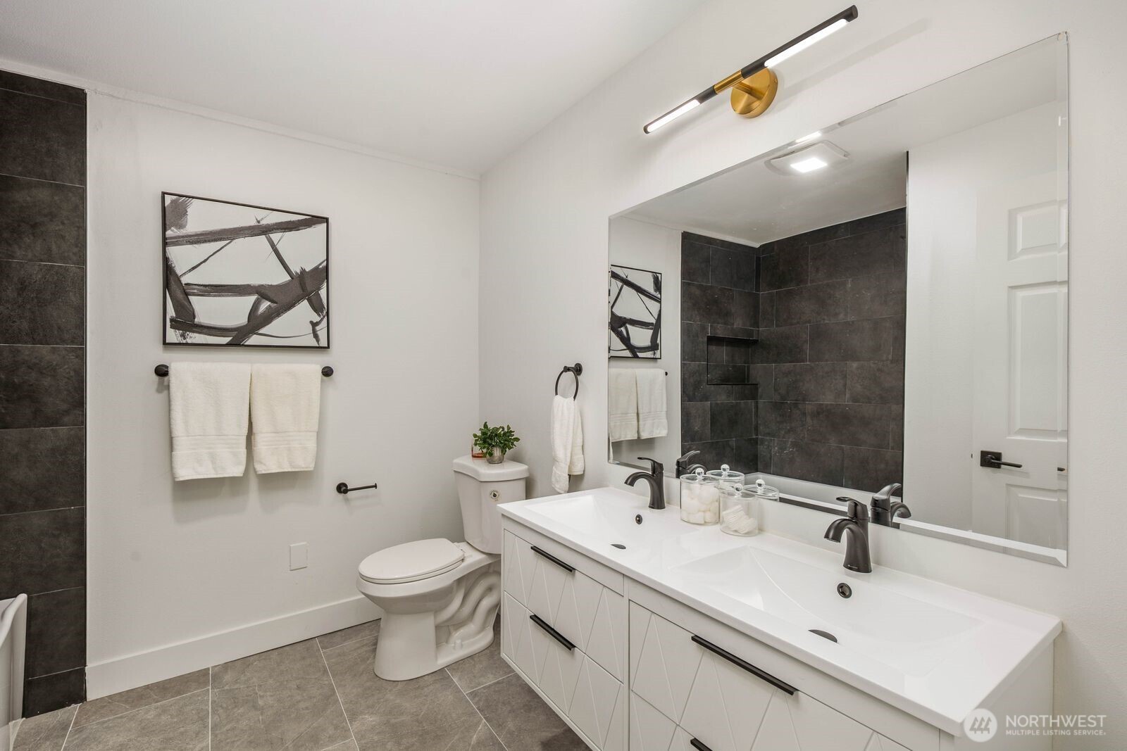 14866 154th Place Southeast Renton, WA 98058 - Photo 19 of 36 a bathroom with a toilet a sink and mirror