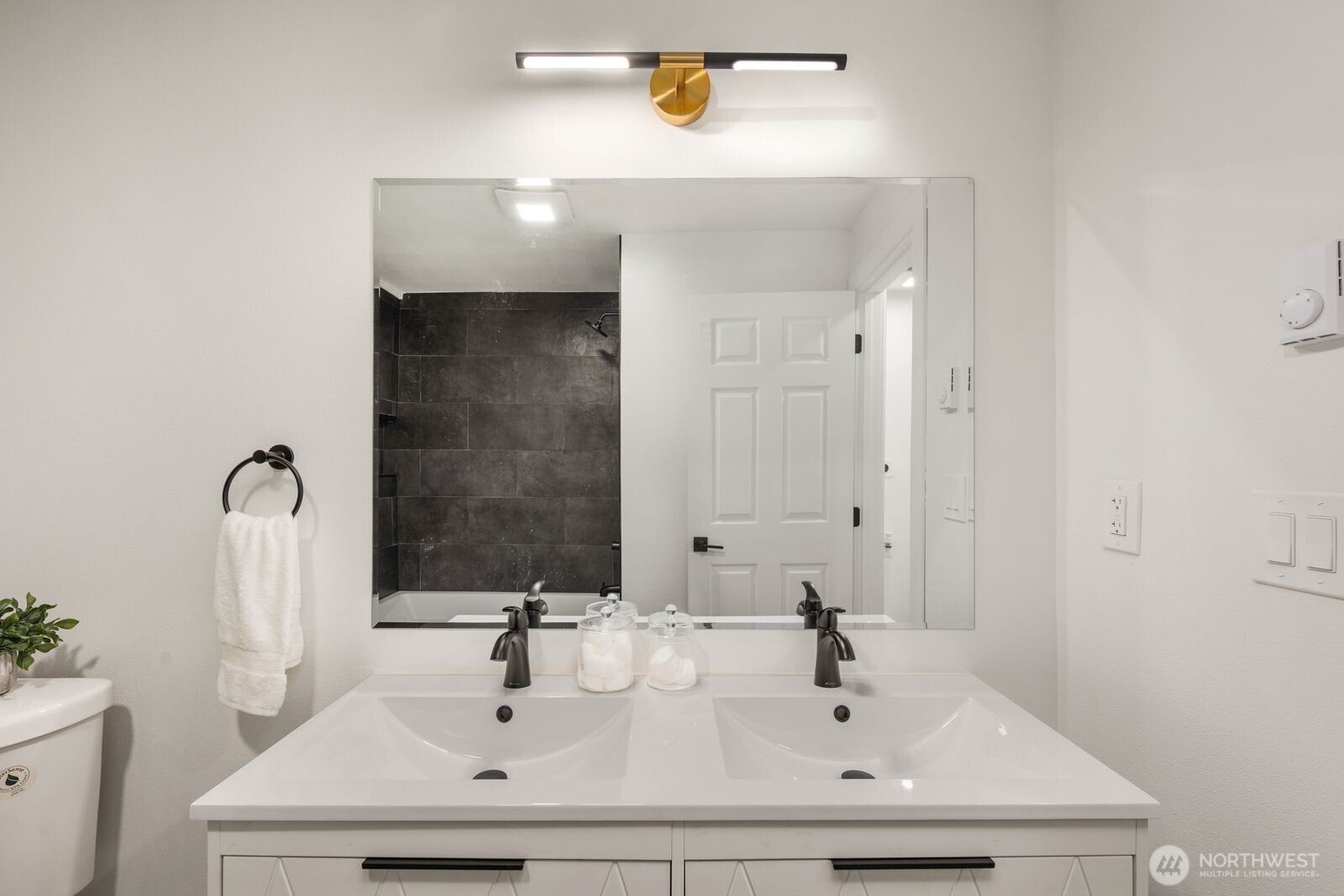14866 154th Place Southeast Renton, WA 98058 - Photo 21 of 36 a bathroom with a sink and a mirror