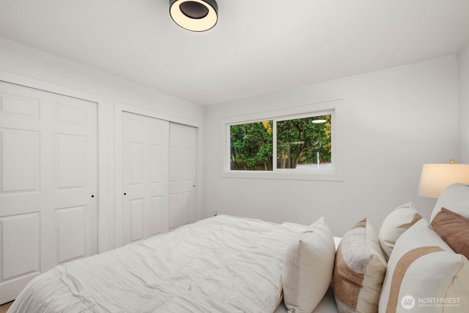 14866 154th Place Southeast Renton, WA 98058 - Photo 23 of 36 a bedroom with a bed and a window